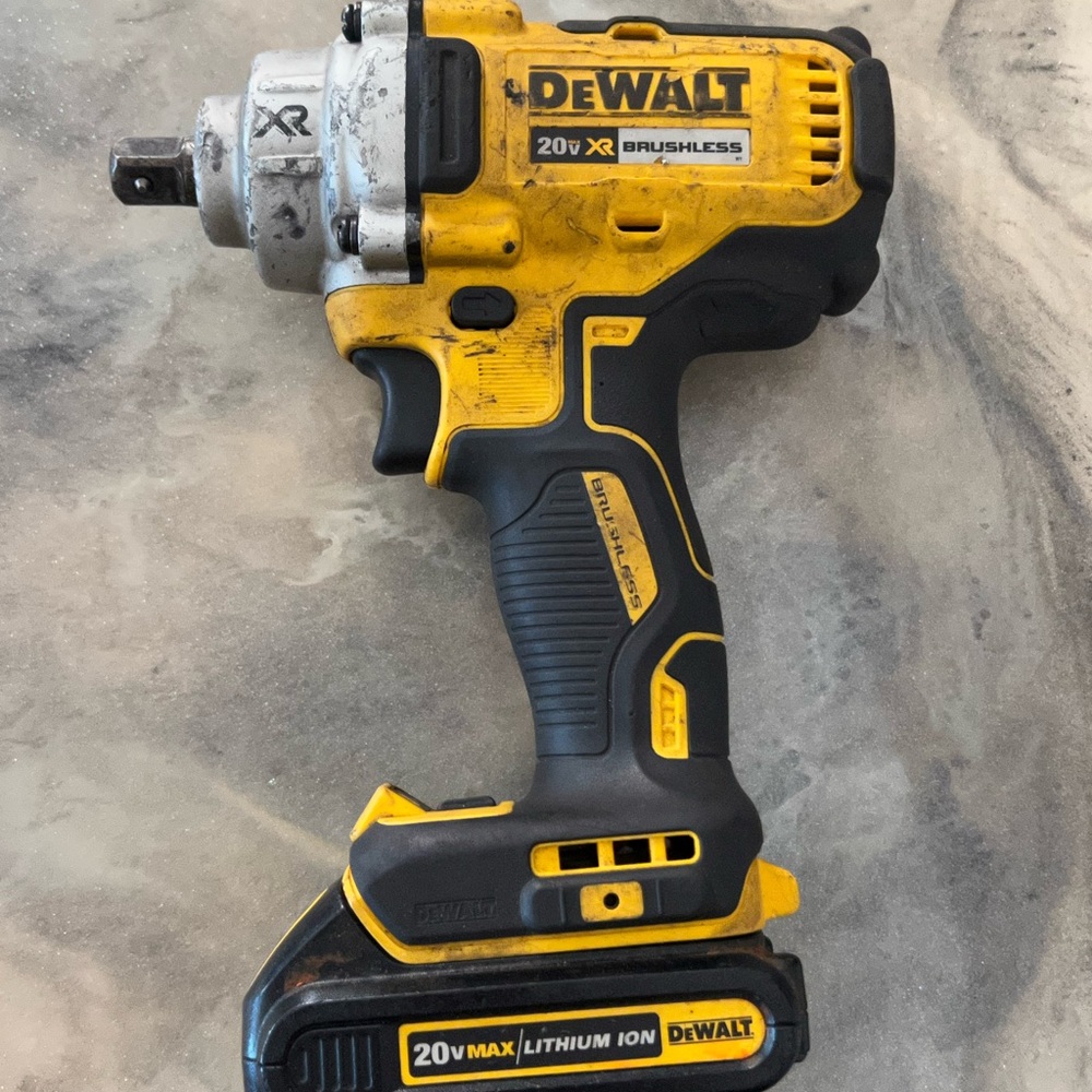 DeWalt 20V XR Brushless Impact Driver - Yellow and Black.With a 20v battery comb